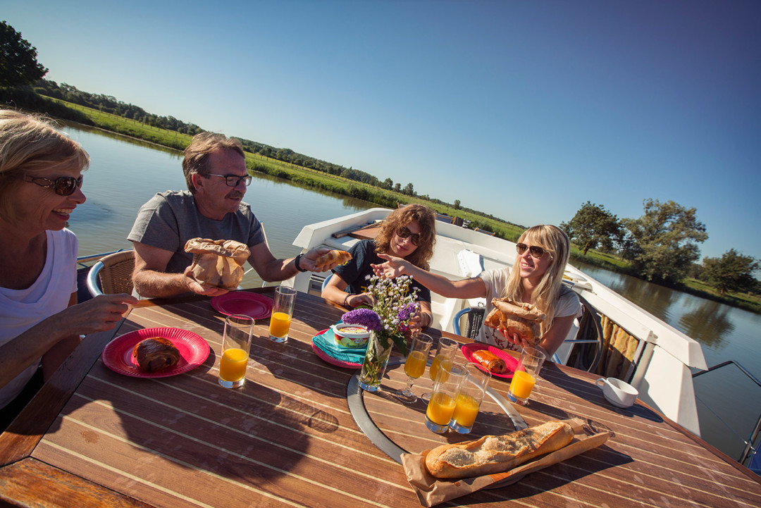 Travellers feasting onboard in Tournus, France