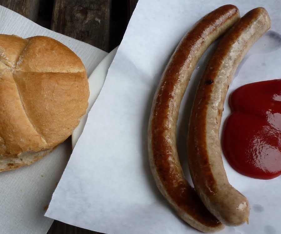 Bratwurst sausage with a bread roll and tomato sauce as a hangover cure