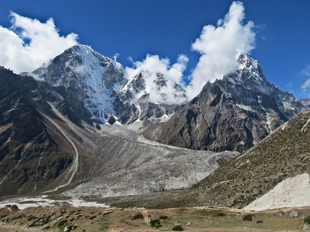 view of peaks reaching into clouds from everest base camp