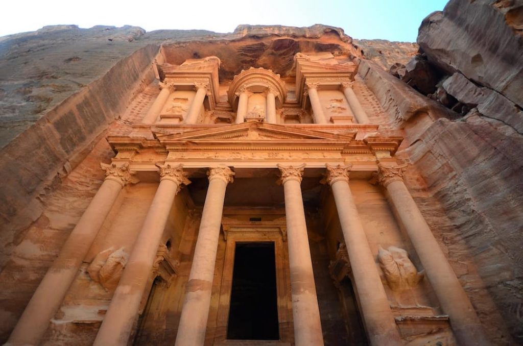 Shot of the pale orange ancient architecture of Petra
