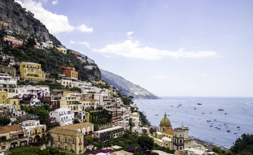 A view of colourful rows of houses from Viale Pasitea in Positano, Italy