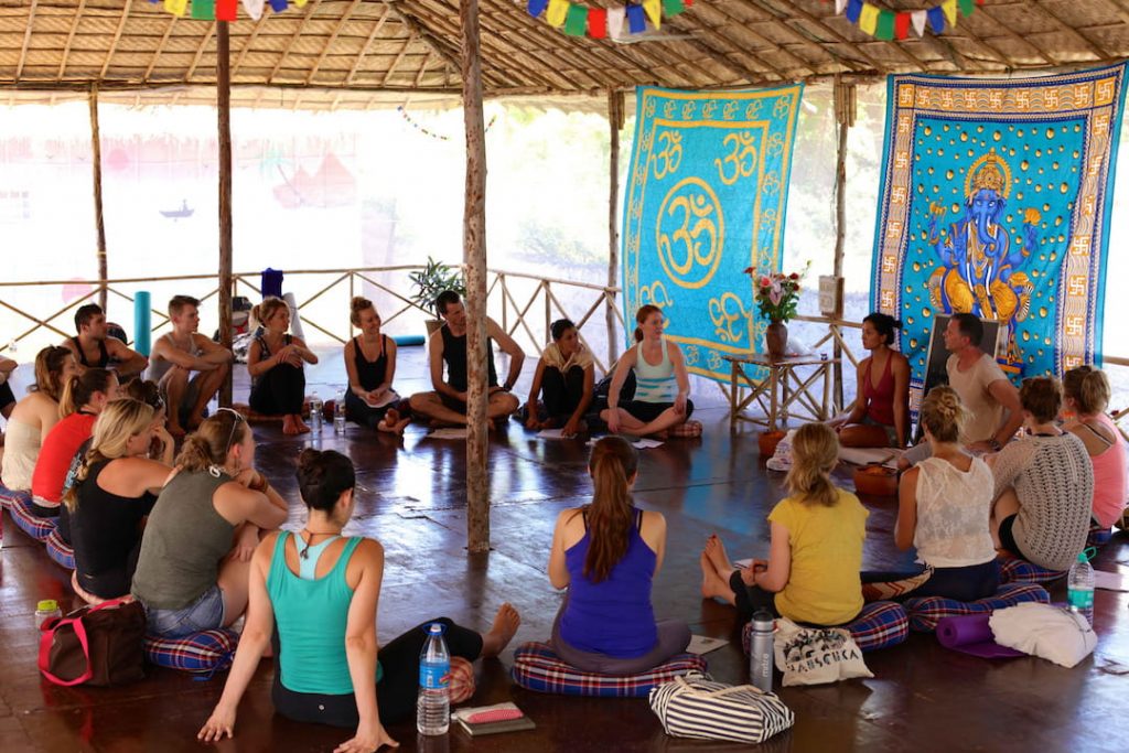 Students gathering in an open room for their 200 hours TTC Goa India by The Yoga People