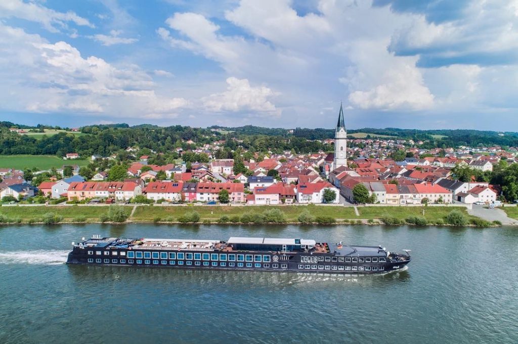 A sleek ship on a river cruise in Europe