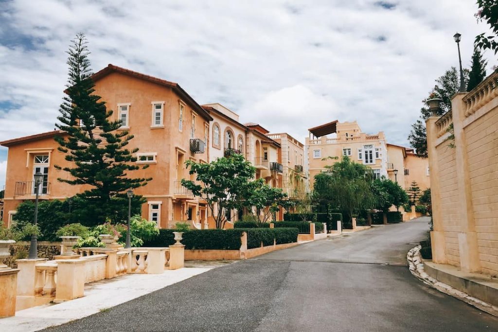A row of orange houses in a housing complex in Thailand