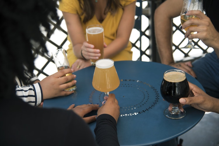 A group of people drinking beers
