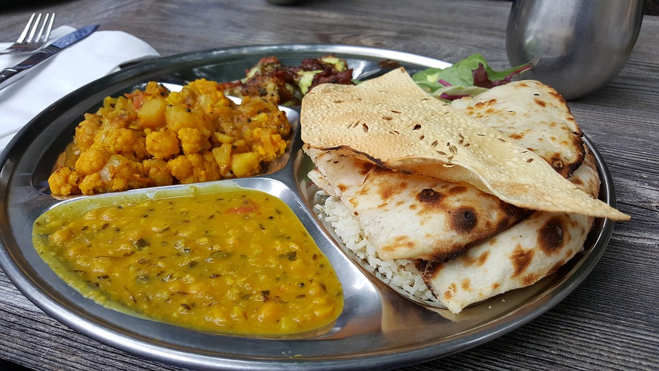 A taal of Indian cuisine: chickpea curry, naan, daal