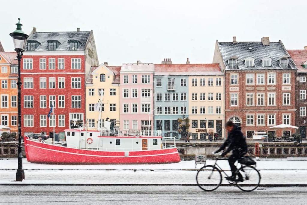 a row of multicoloured houses on a canal in Denmark