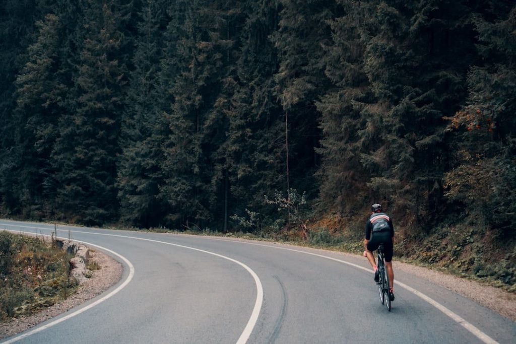 A man rounds a corner on a road in Yablunytsia, Ukraine