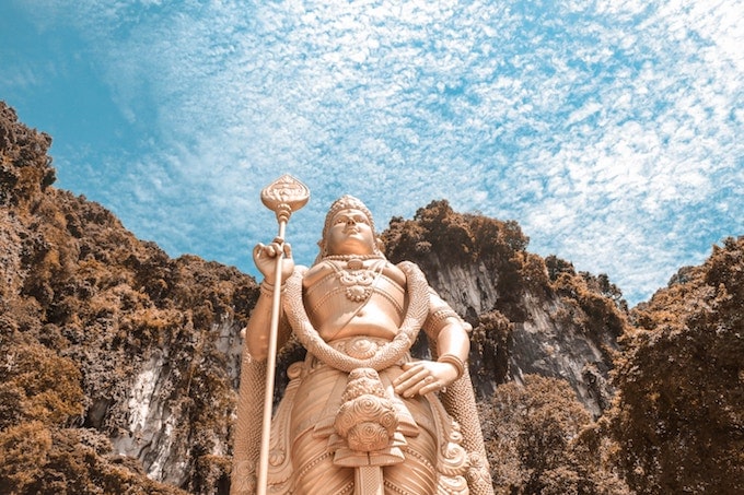 A large gold statue in front of the batu caves, Malaysia