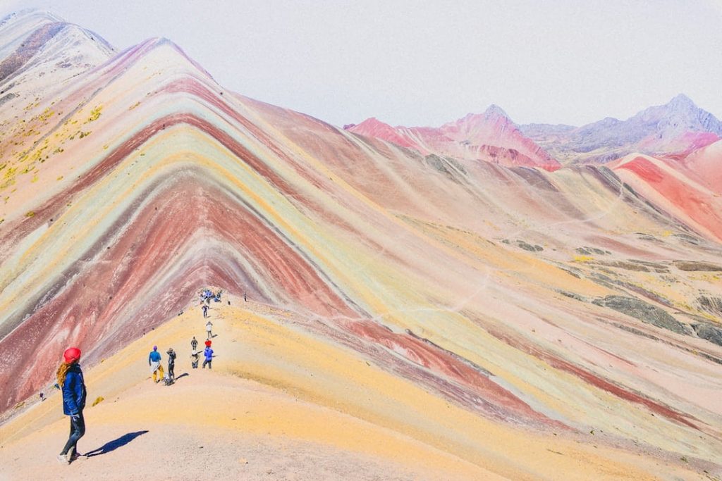 People walking along Rainbow Mountain, Peru