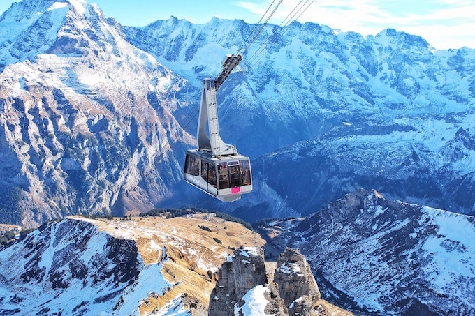 a gondola going up a mountain in switzerland