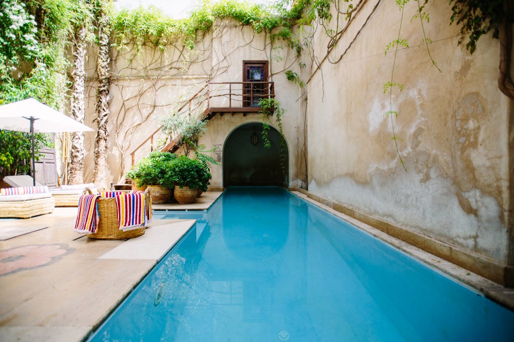 an indoor stone pool in a courtyard