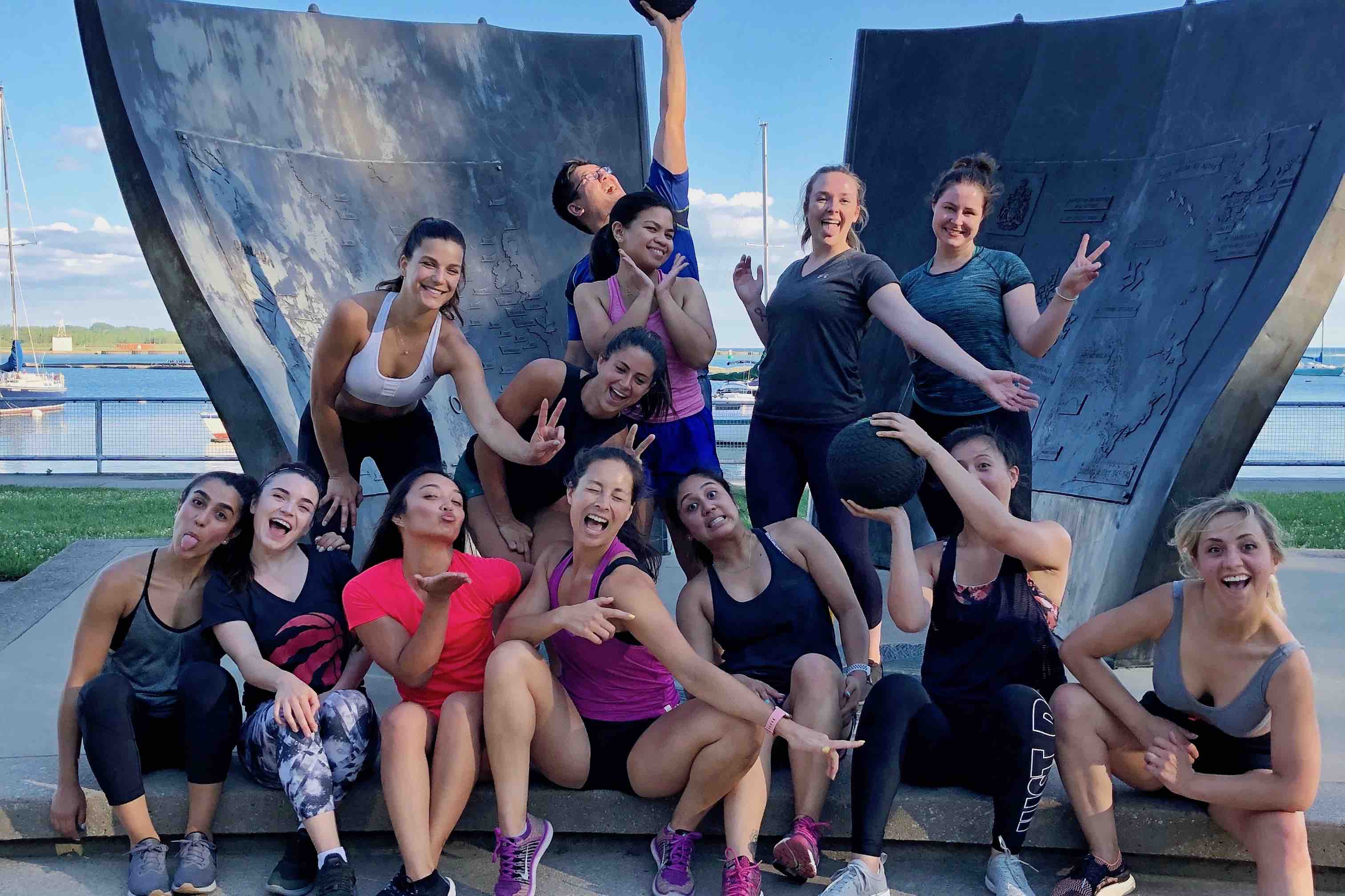 a group of people posing after a workout