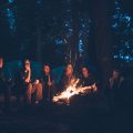 A group of friends sitting around a fire