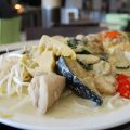 a heap of coloured vegetables in a coconut curry