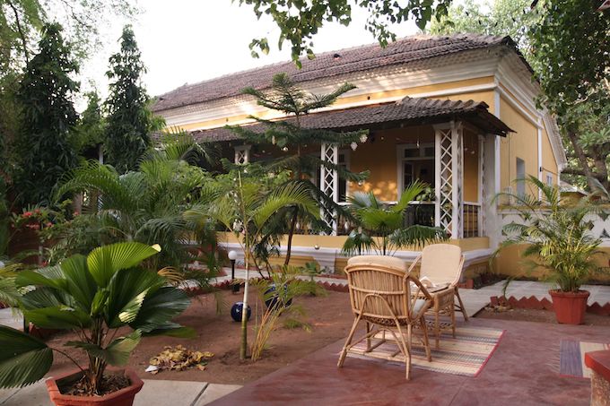 A small yellow bed and breakfast in Goa, India