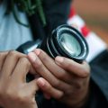 A person holding a camera up close