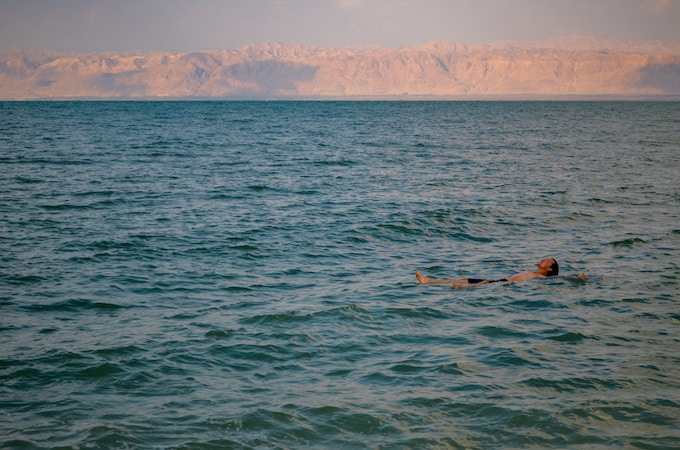 A man floating on the Dead Sea in Jordan