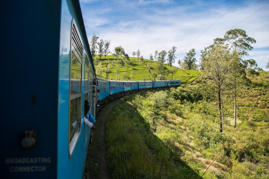 Blue train winding through the Sri Lankan countryside