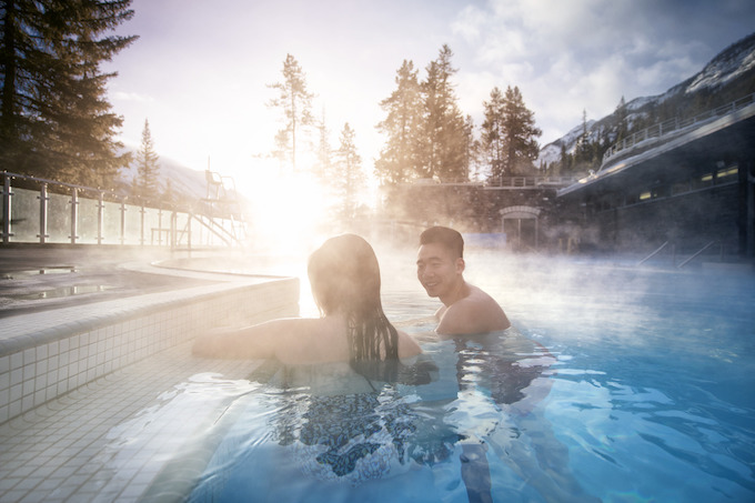 two people relaxing in a hot spring