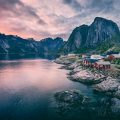 A fishing village and mountains in the Lofoten Islands, Norway, at sunset