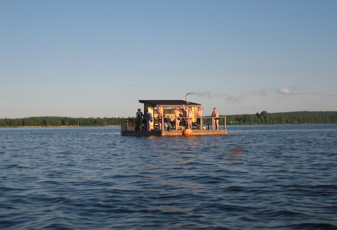 A group of Finnish men on a party boat on a river in Finland