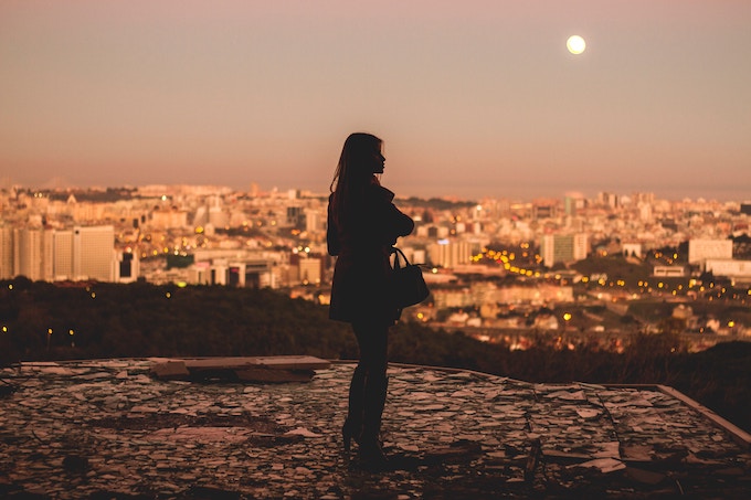 A woman standing on a hill in Lisbon, Portugal