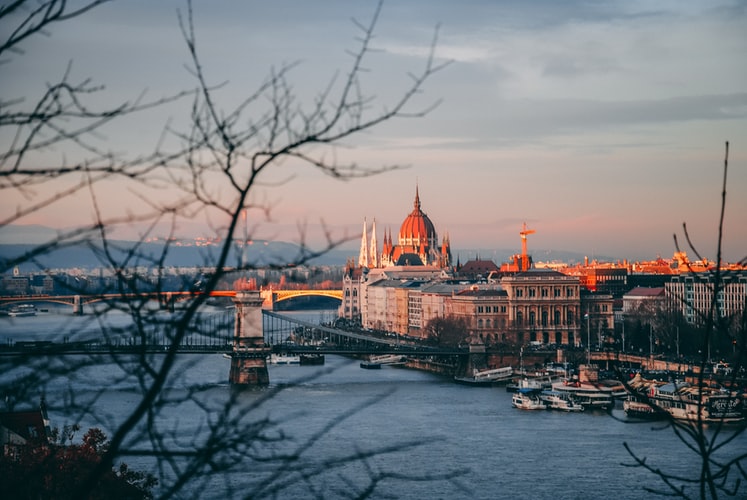high-angle photography of dome building near bridge and body of water