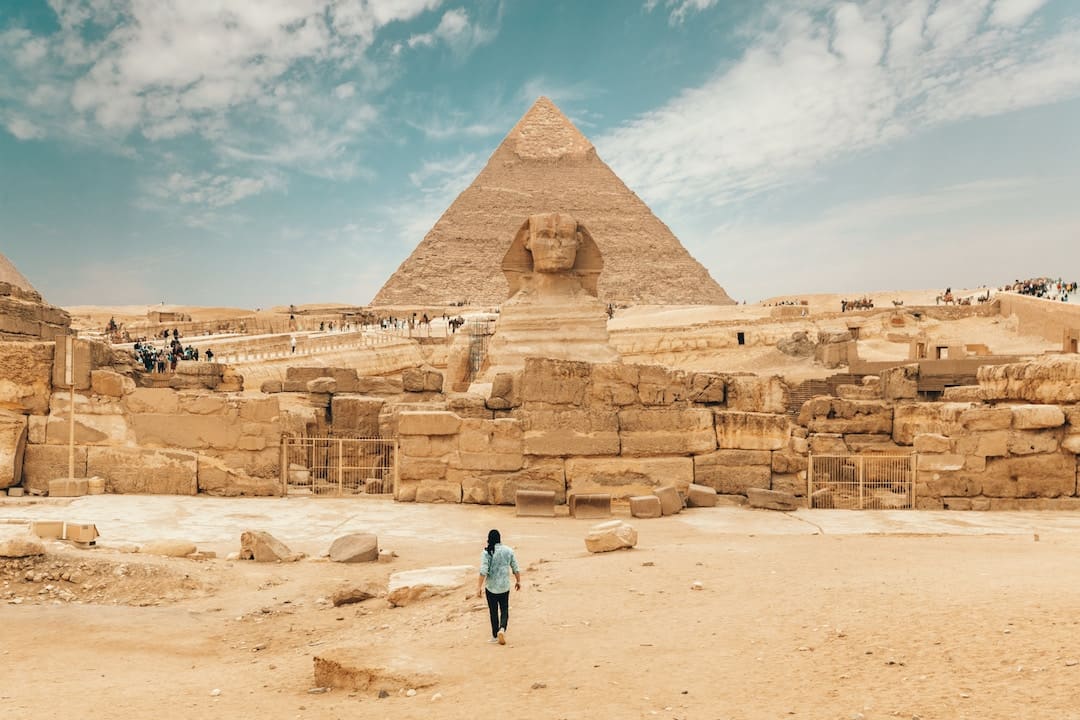 A man walking towards a Pyramid in Egypt