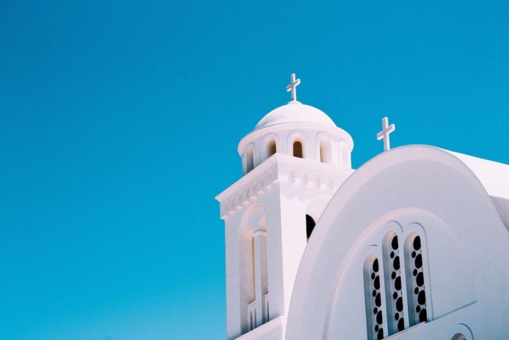 Blue sky and the domes of a whitewashed church in Paros, Greece