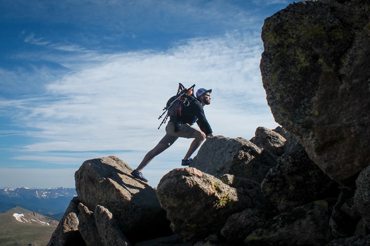 a man on rocks climbing