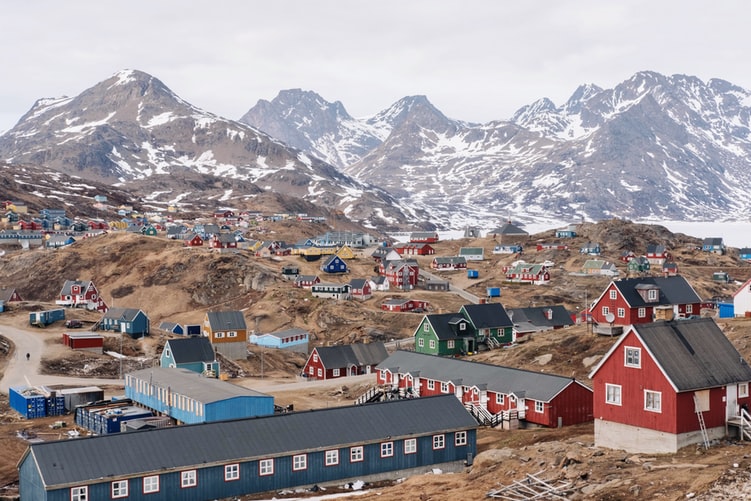 colourful houses on brown hill during daytime