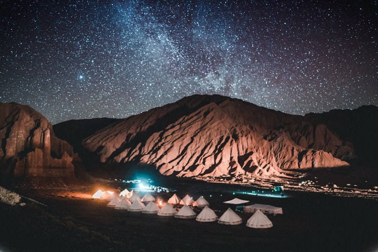 tents below the night time sky
