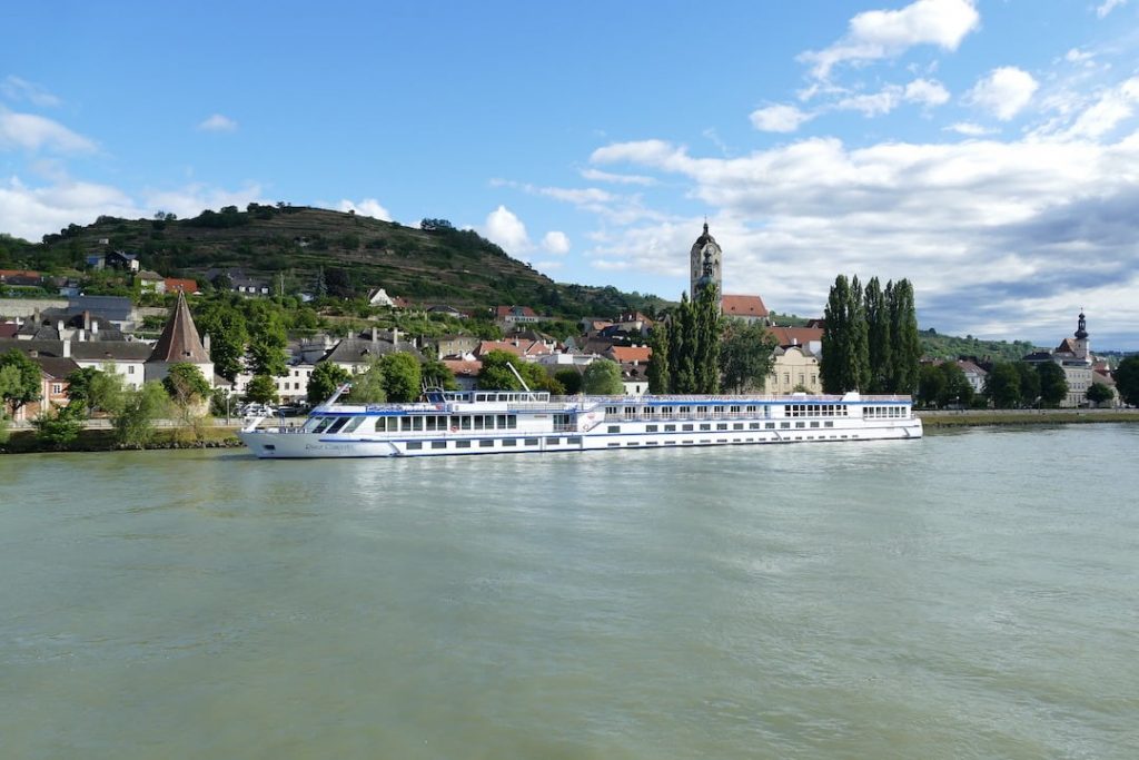 A river cruise ship docked in a city along the Danube