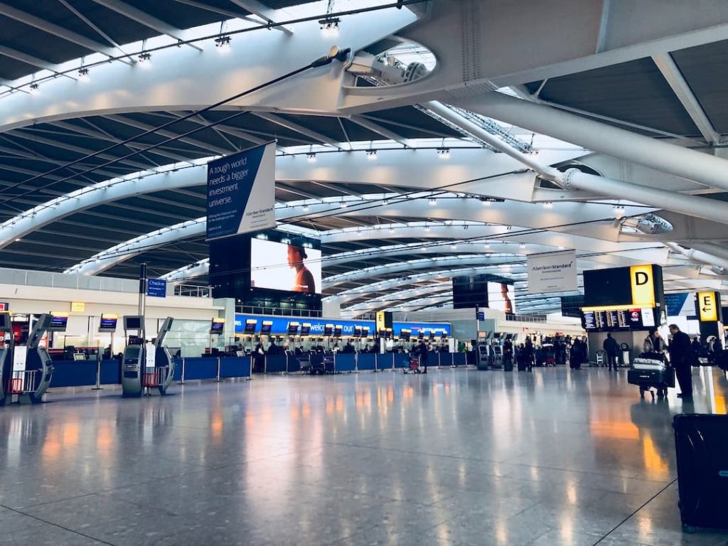 Check in counters and travellers in an airport
