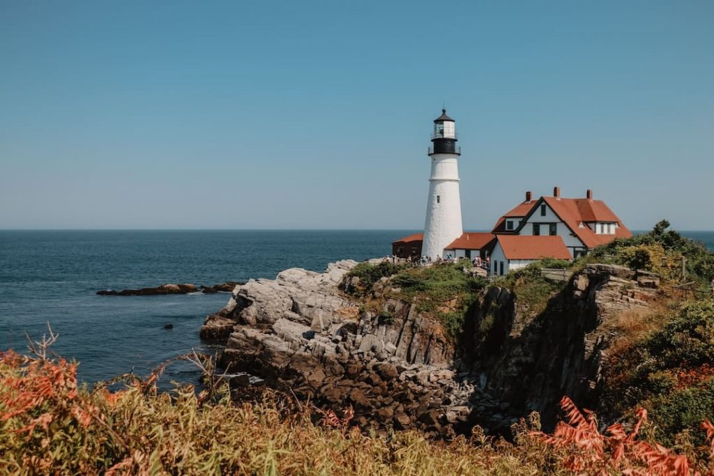 Lighthouse perched on a rocky shoreline in Portland, Maine, USA
