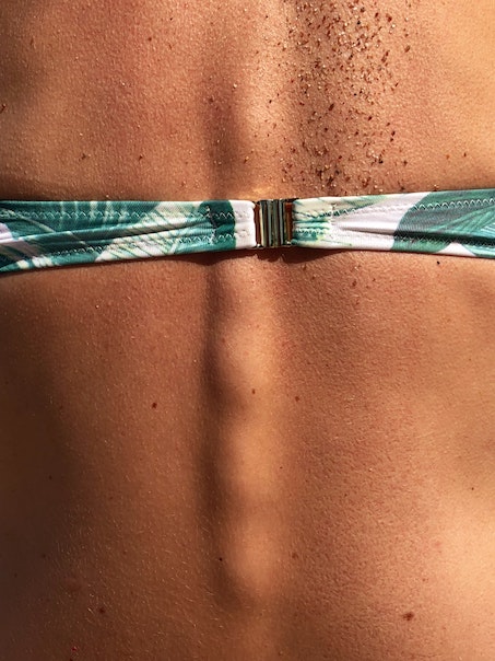 arty picture of a woman's bikini clasp close up