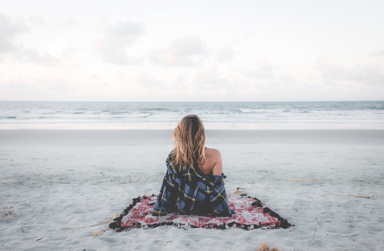 a woman relaxing on the beach