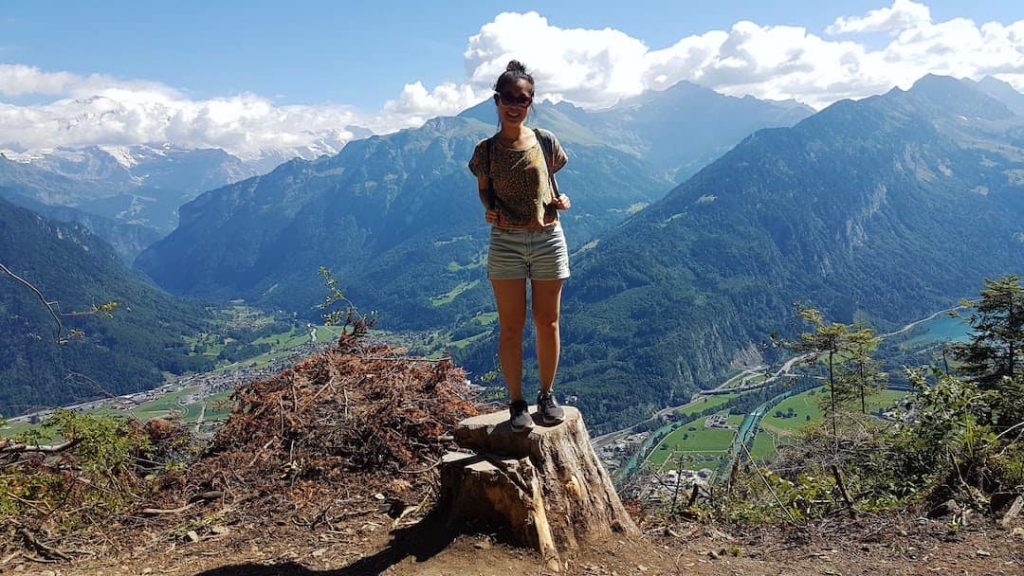 Woman standing at a lookout point in Interlaken, Swizterland